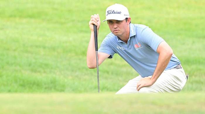 J.T. Poston looks over a putt in the second round of the 2022 John Deere Classic.
